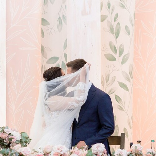 Bride and groom kissing