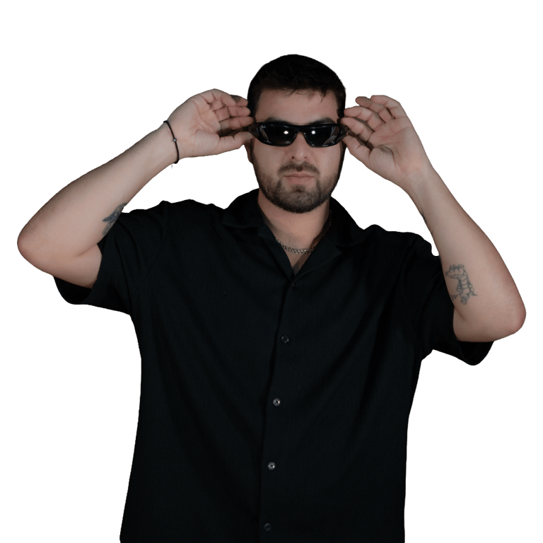 Memo Pearls, Puerto Vallarta DJ and founder of The Door, adjusting sunglasses during a photoshoot