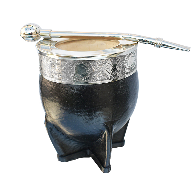 Handcrafted black leather yerba mate gourd with an ornate silver rim and a metal bombilla straw.