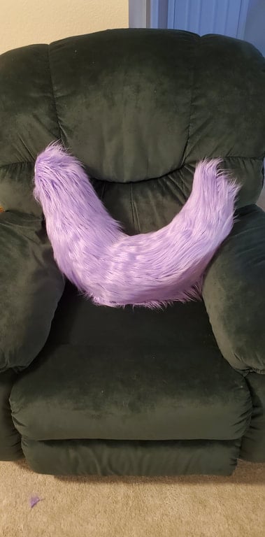 A fluffy purple tail made by Teto Creations