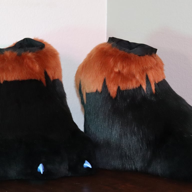 Feet paws made by Teto Creations featuring 3d-printed claws and a detailed EKG pattern