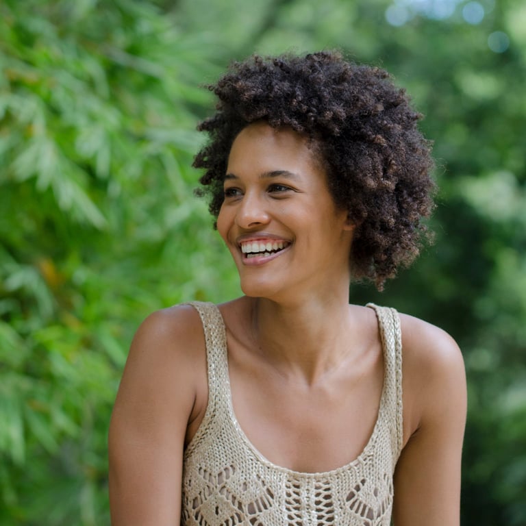 Beautiful woman with afro hairstyle smiling