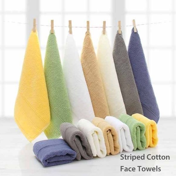 a variety of striped cotton face on a clothes line