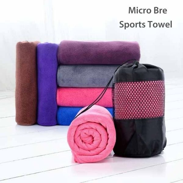 a micro bre hand towel with black bag on white floor