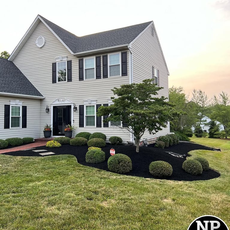 excellent landscaping and hardscaping of grass, stones and trees by NP Landscaping