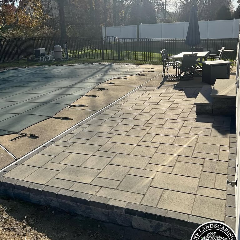 excellent landscaping and hardscaping of grass, stones and trees by NP Landscaping