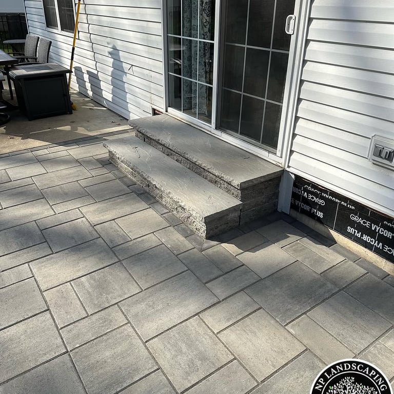 excellent landscaping and hardscaping of grass, stones and trees by NP Landscaping