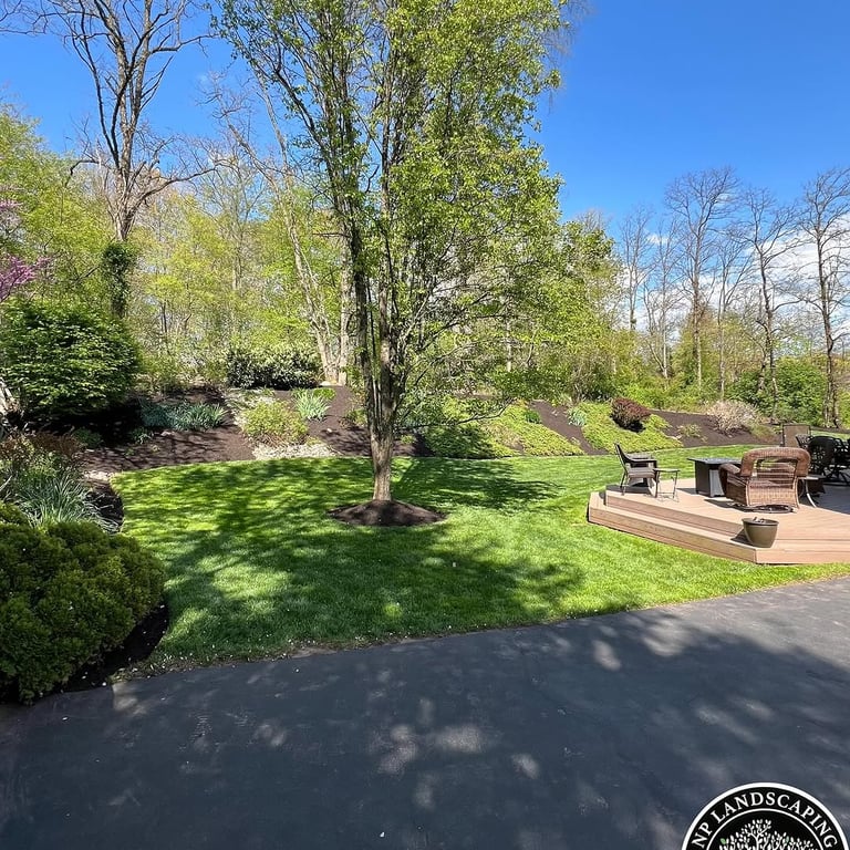 excellent landscaping and hardscaping of grass, stones and trees by NP Landscaping