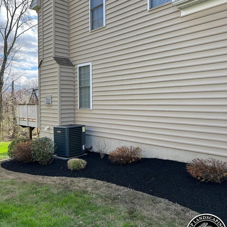 excellent landscaping and hardscaping of grass, stones and trees by NP Landscaping