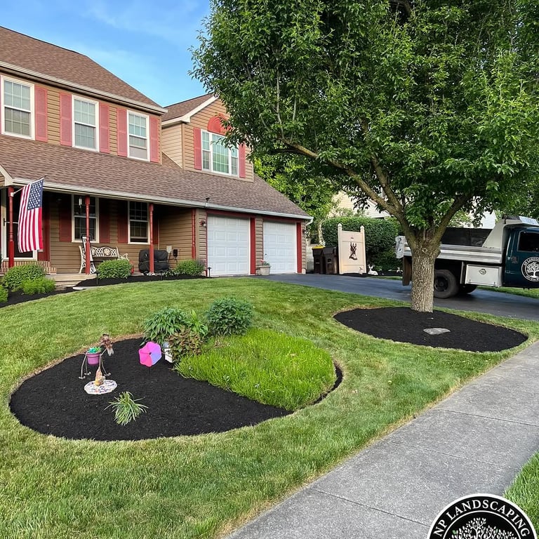 excellent landscaping and hardscaping of grass, stones and trees by NP Landscaping