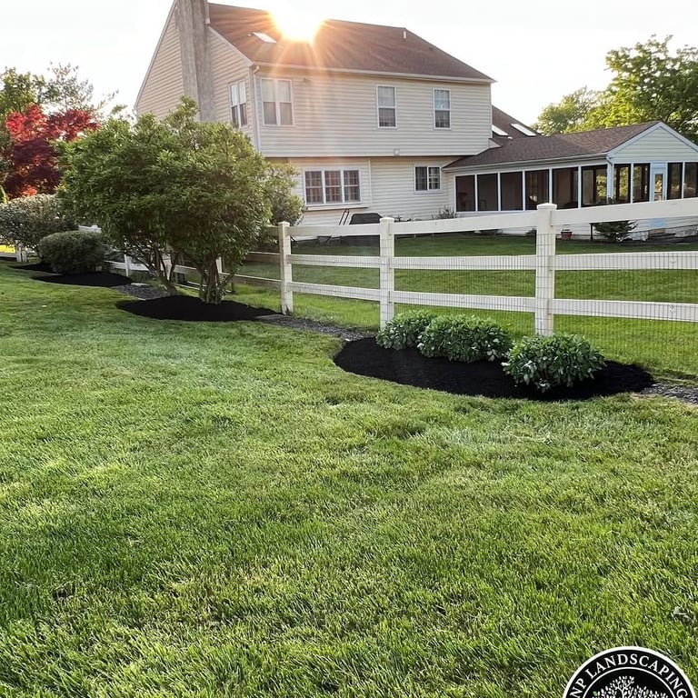 excellent landscaping and hardscaping of grass, stones and trees by NP Landscaping