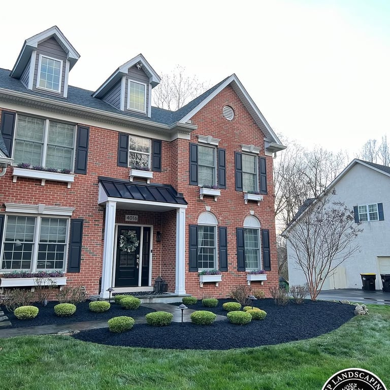 excellent landscaping and hardscaping of grass, stones and trees by NP Landscaping