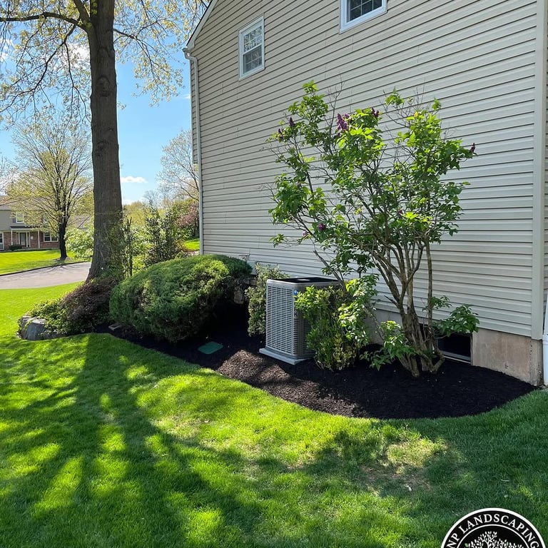 excellent landscaping and hardscaping of grass, stones and trees by NP Landscaping
