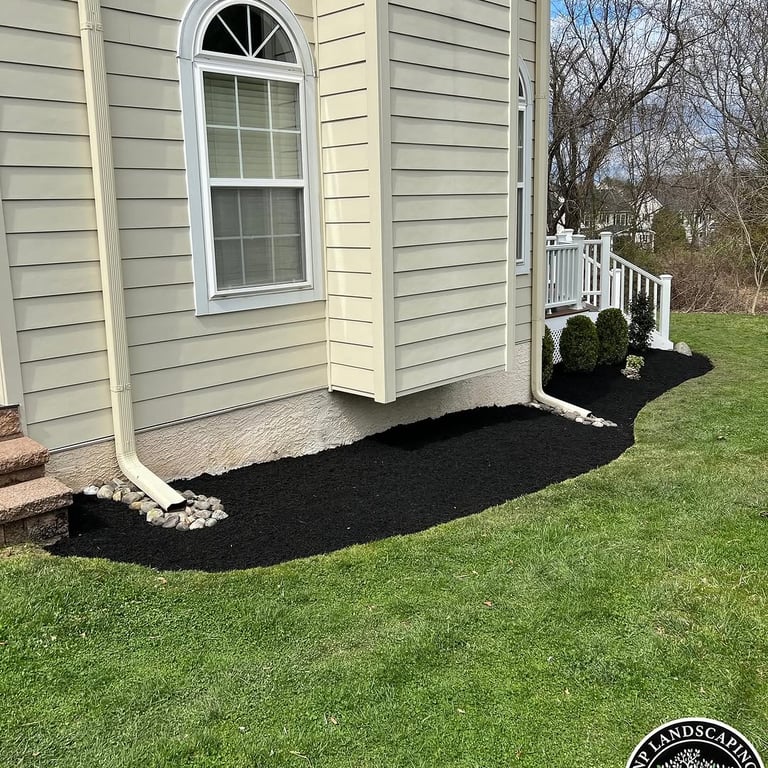 excellent landscaping and hardscaping of grass, stones and trees by NP Landscaping