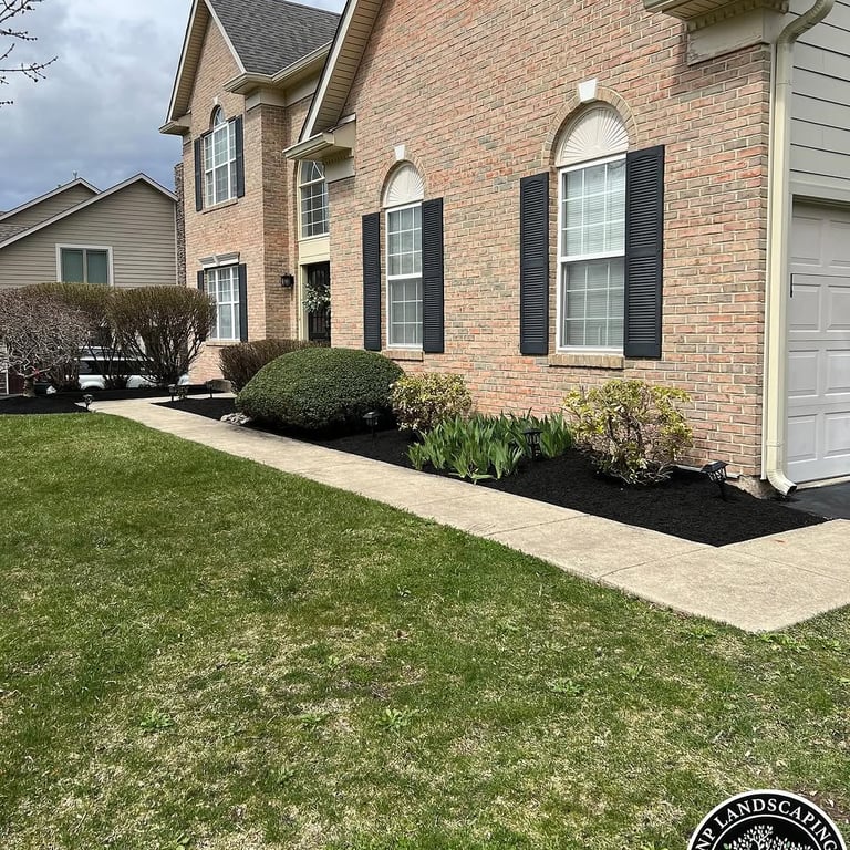 excellent landscaping and hardscaping of grass, stones and trees by NP Landscaping