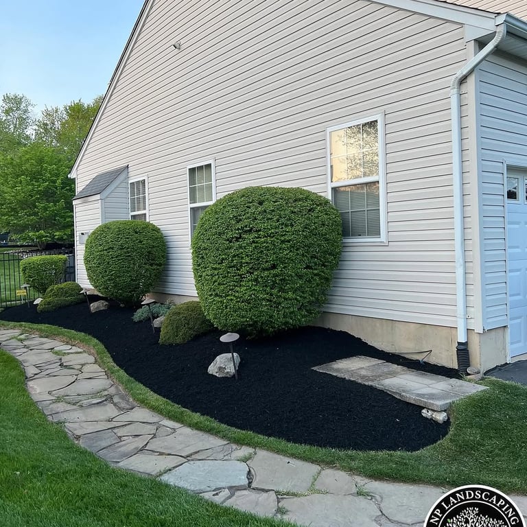 excellent landscaping and hardscaping of grass, stones and trees by NP Landscaping