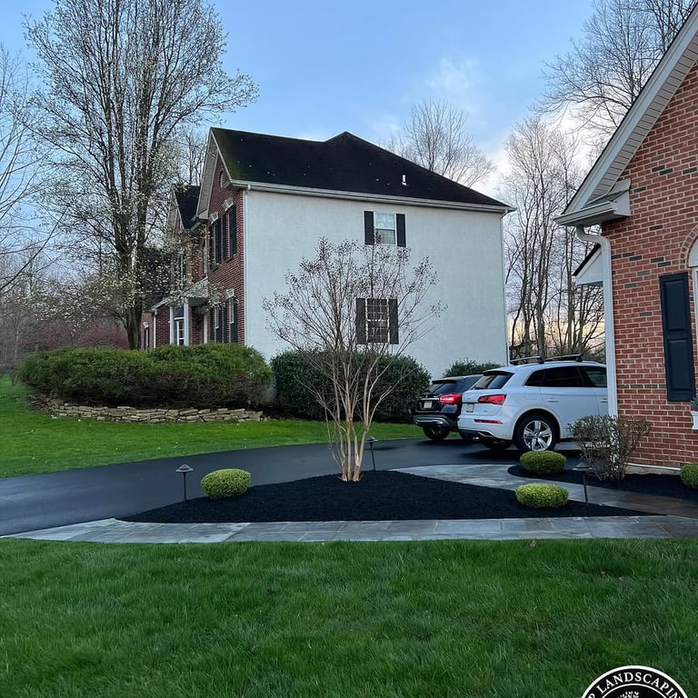 excellent landscaping and hardscaping of grass, stones and trees by NP Landscaping