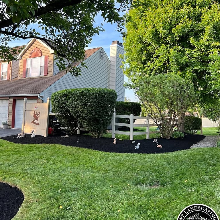 excellent landscaping and hardscaping of grass, stones and trees by NP Landscaping