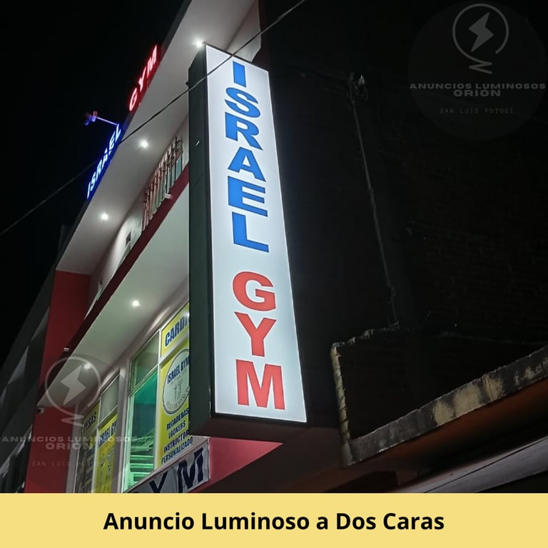 Anuncio Luminoso Tipo Bandera a Dos Caras, con letras a color azul y gris en fondo blanco. En SLP.