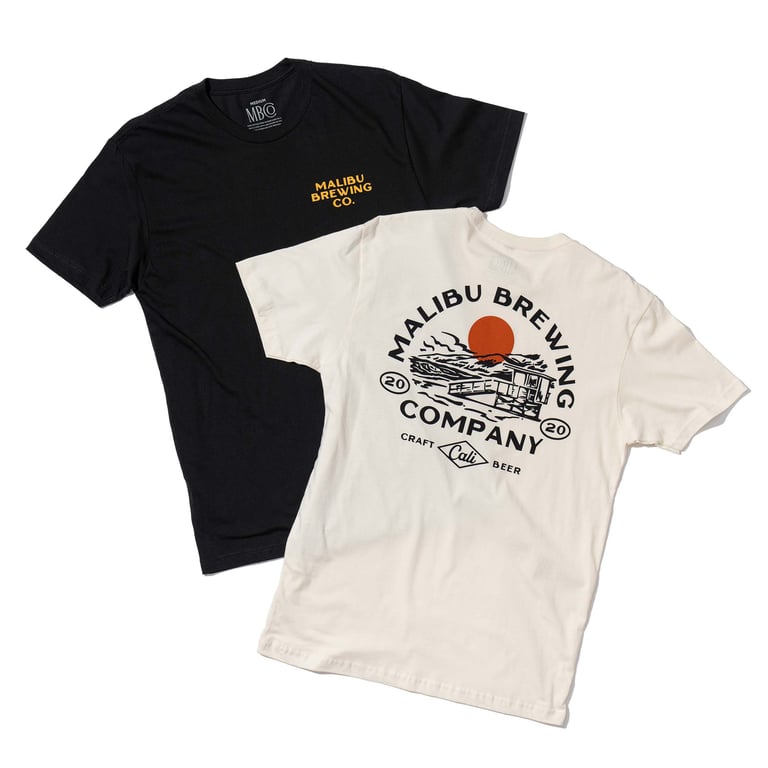 Product photography of two t-shirts for Malibu Brewing Co.: a black shirt with a small front logo and a natural/off-white