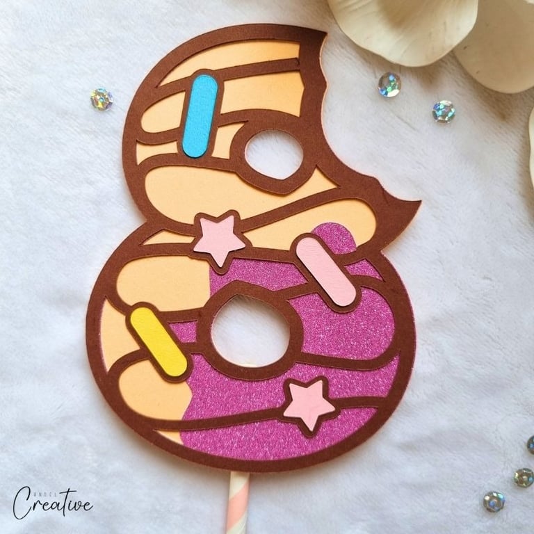 Cake topper in a shape of number 8 and a donut style.