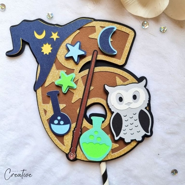 Cake topper in the shape of a number 6. Wizard style.