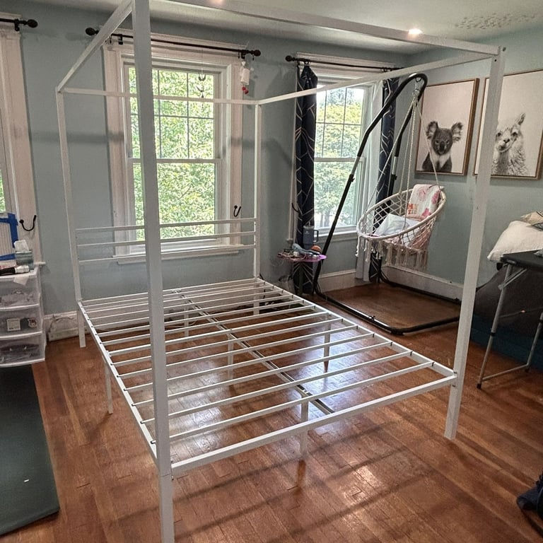 After assembly photo of a The Art of Living canopy platform bed frame.