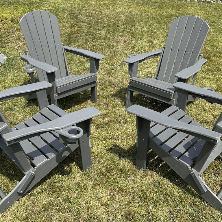 Set of 4 folding Adirondack chairs assembled for a client in Andover, MA. HDPE gray, with cup holders.
