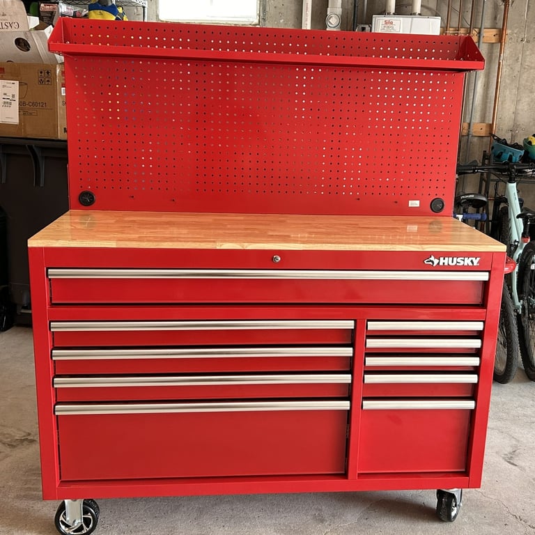 Fully assembled gloss red 52-inch Husky rolling workbench