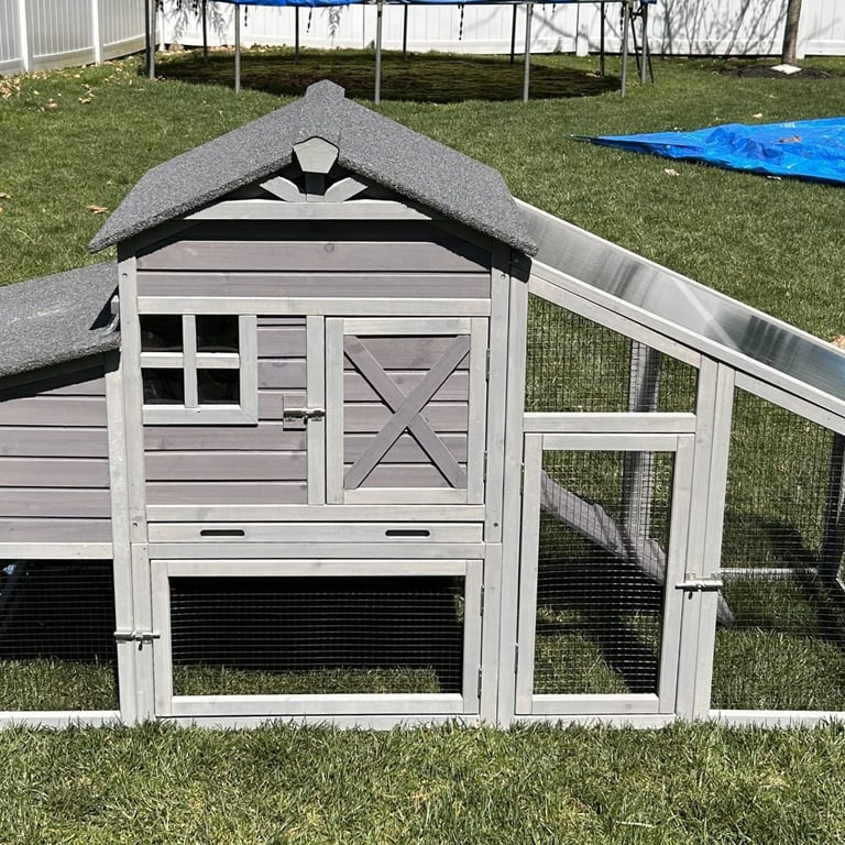 assembled wooden chicken coop with asphalt roof
