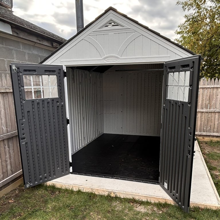 Suncast Tremont resin shed with front doors open showing the interior