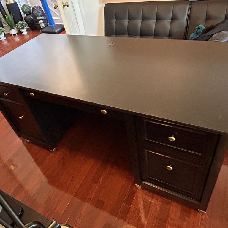 Sauder Edge Water executive desk assembled for a client in North Andover, MA. Estate black with client-enhanced color scheme.