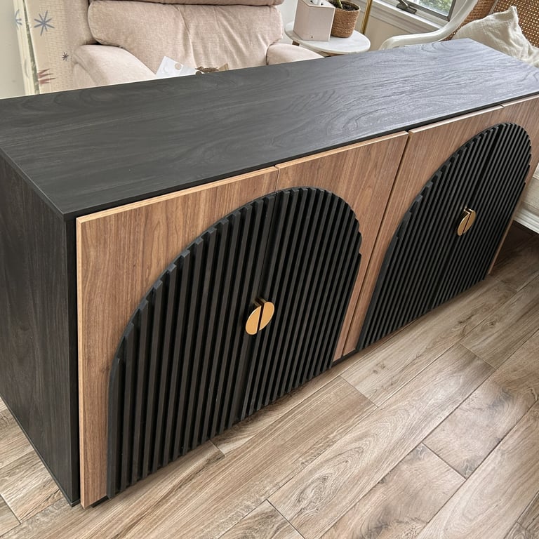 A Belleze black and brown 65-inch sideboard buffet cabinet with fluted doors and brass pulls.