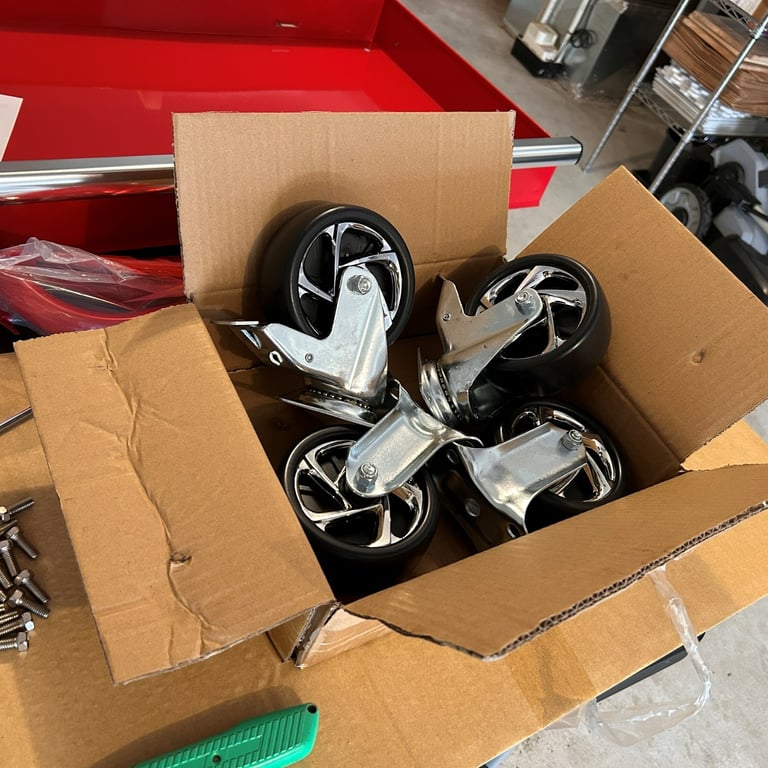 Two locking wheels and two regular wheels for the Husky rolling workbench