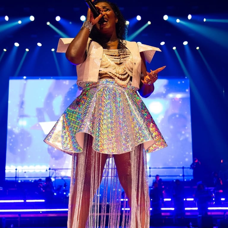 a woman in a white dress and a microphone