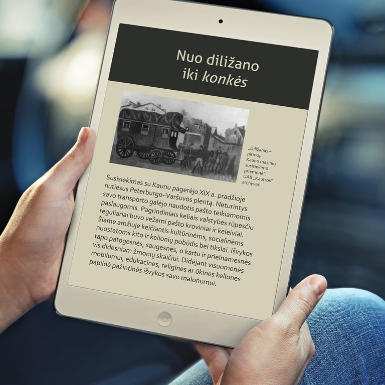 A man is holding a tablet and reading the book "90 Years on the Road", in a pdf format adapted for the visually impaired.