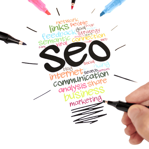 a person holding a pen and writing on a paper