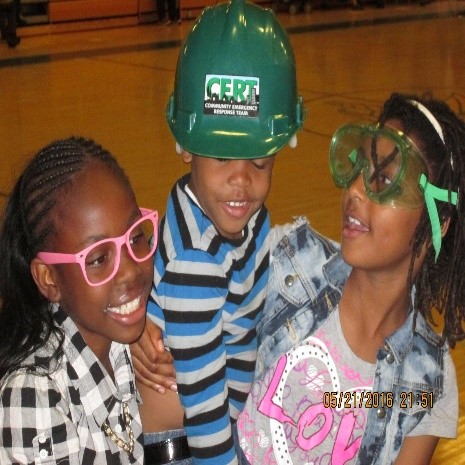 three young children wearing safety glasses and safety glasses