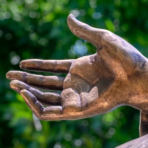 Close up on the hand of Saint Barbara - gesture of devotion.