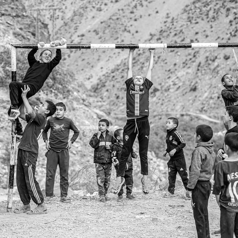 A powerful black and white image showing that the love for football transcends bysaid mrigua photographer