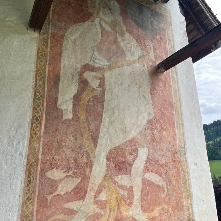 Frescos on the outside of Sankt Michaelskirche in Erlenbach im Simmental