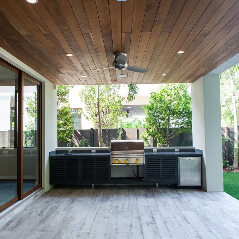 showing of a back patio with a large outside grill and sink and refrigerator