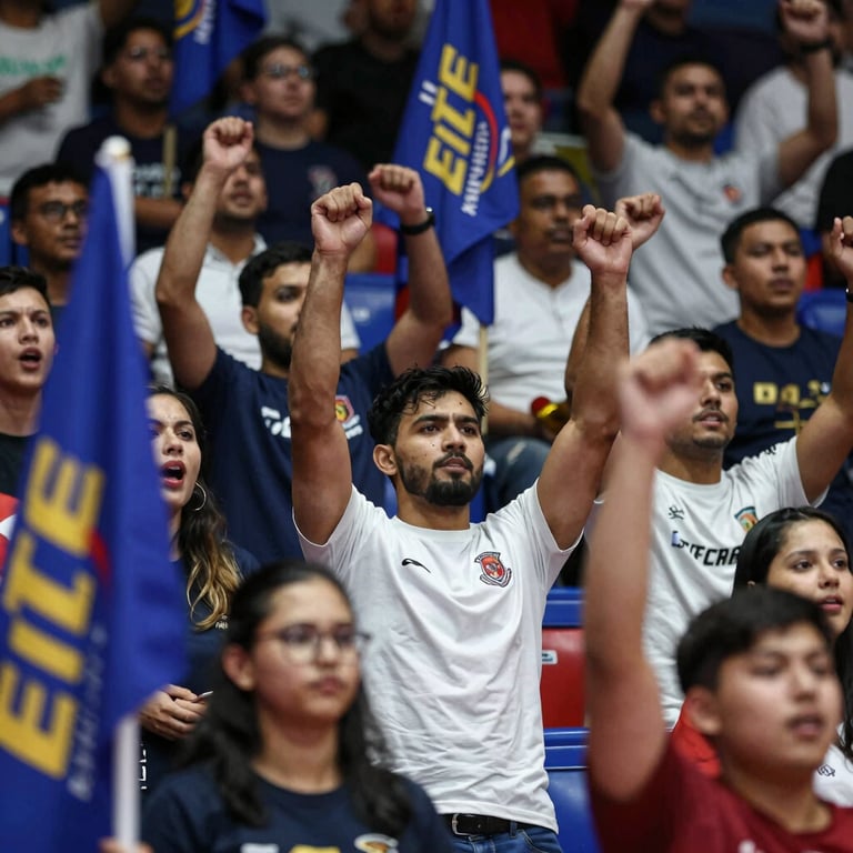 Passionate fans in the stands at a Brampton venue cheering with the Elite Kabaddi Federation logo visible on flags.