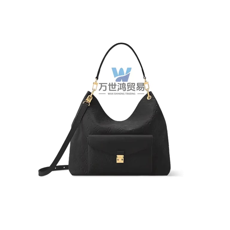 Black embossed leather monogram hobo bag with gold hardware and a front pocket.