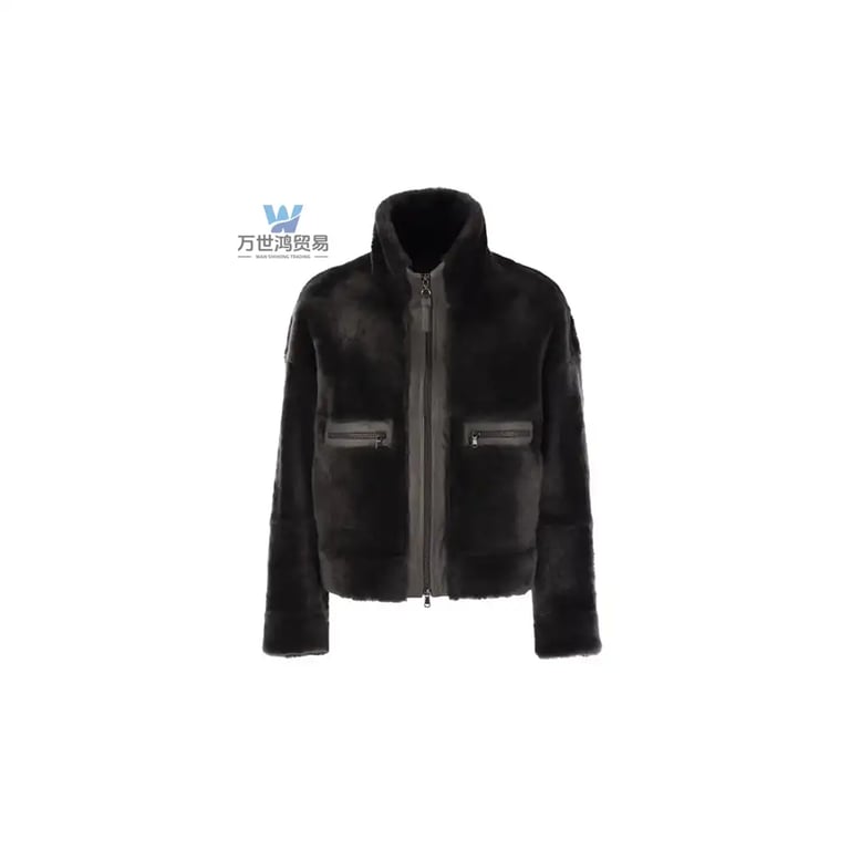 Black faux fur bomber jacket with high collar and zippered pockets for winter fashion.