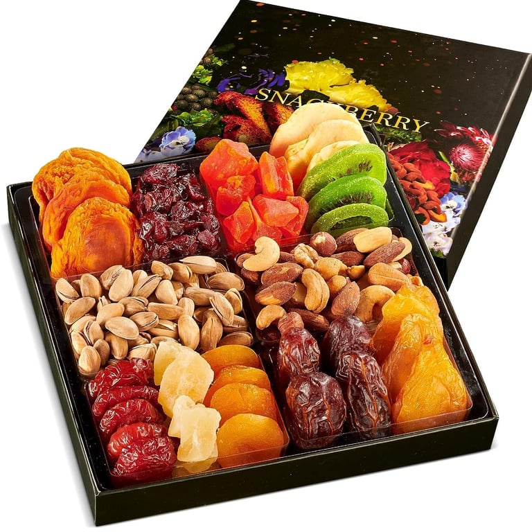 Gourmet gift box containing assorted dried fruits like apricots, kiwi, and dates with roasted nuts and pistachios.