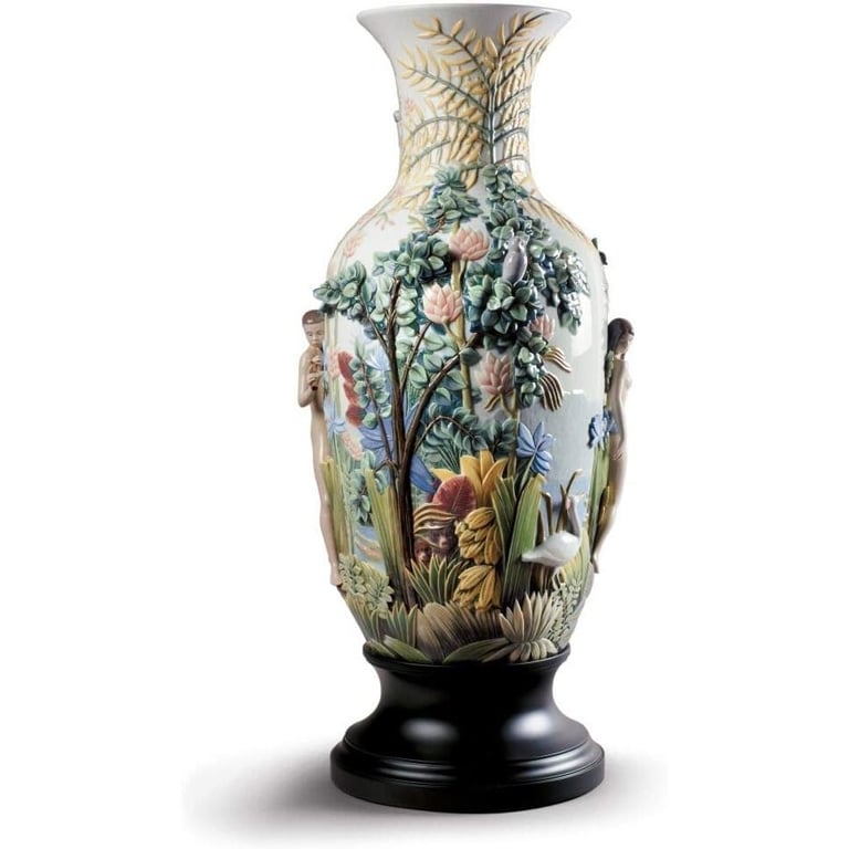 Ornate Lladró porcelain vase featuring a detailed tropical jungle relief with exotic flowers and figures.