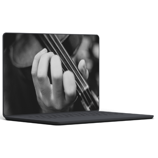 A gray laptop screen displaying a black and white close-up of a musician's hand playing the violin.