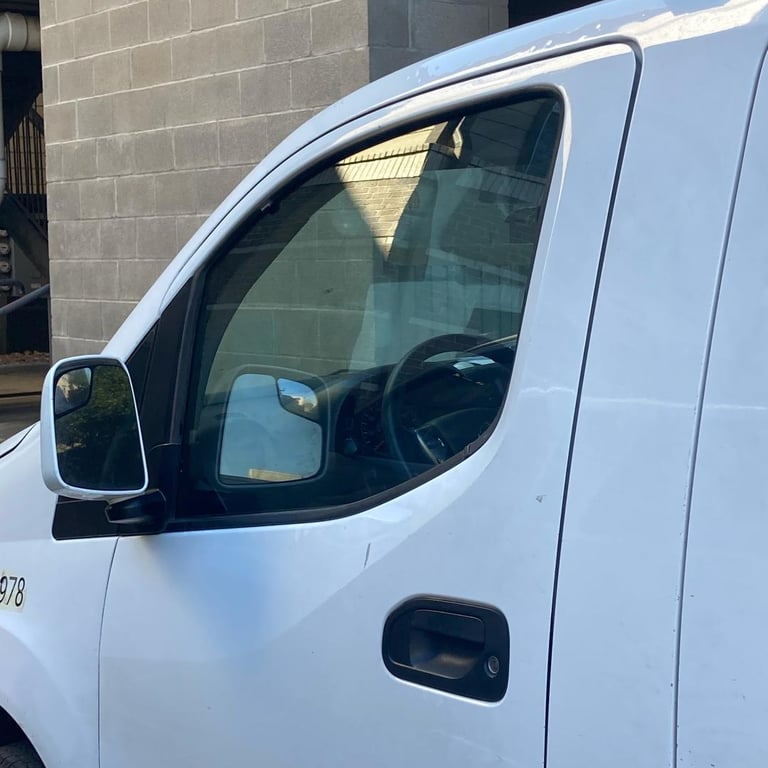 a van parked on the side of a street