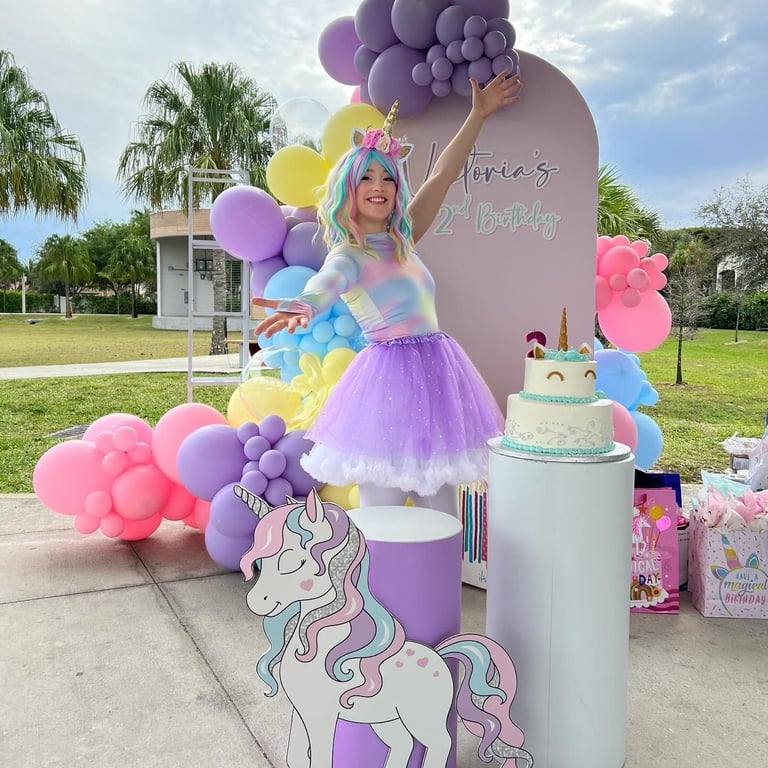 Party entertainer with a unicorn costume themed for the party celebrates your kids birthday